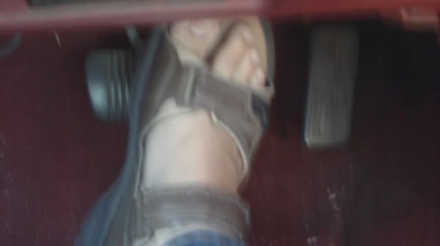 Driving in sandals - male feet